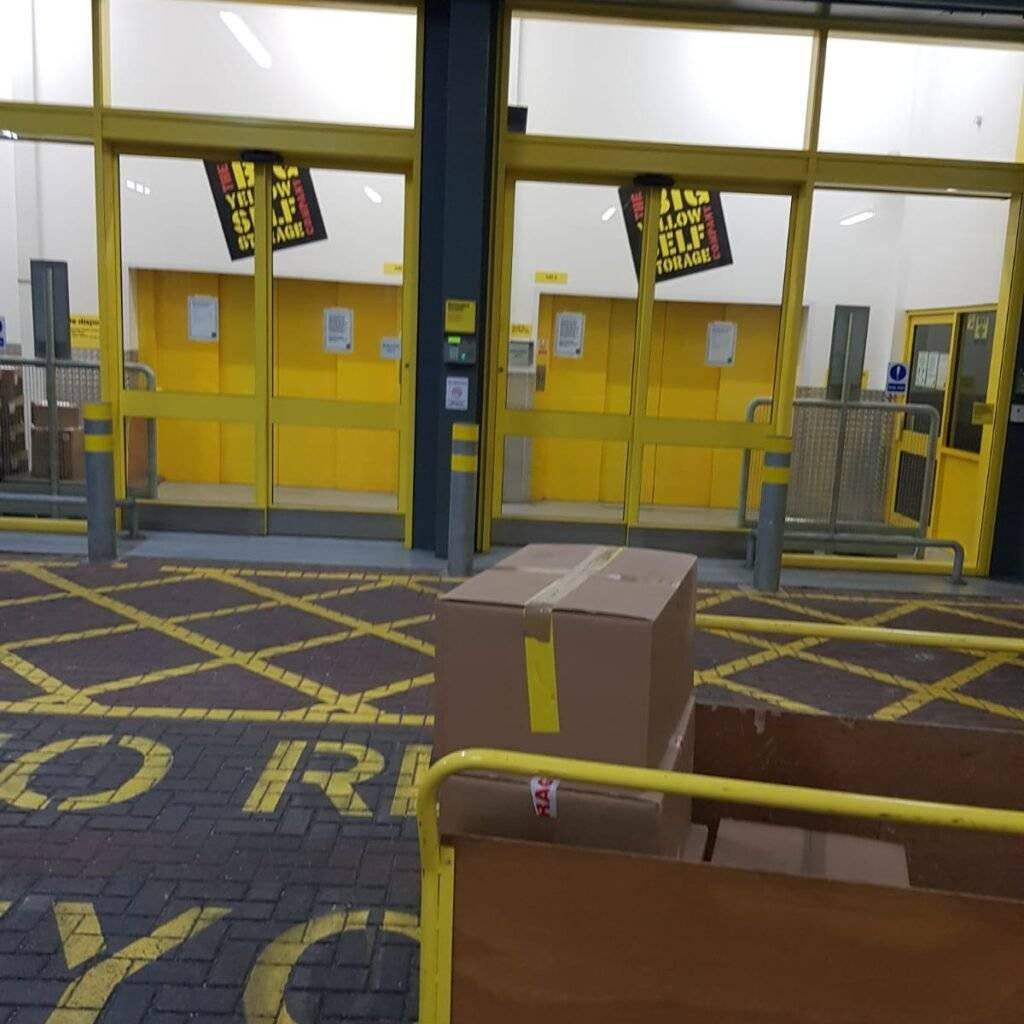 There are packed boxes in the trolleys or in the boxes present in the storage unit