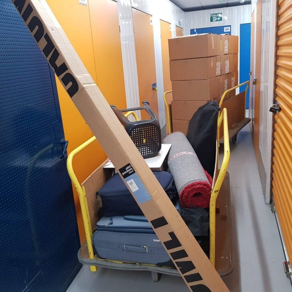 In this pic packed boxes, bags and other things are places in the trolleys near the storage section.